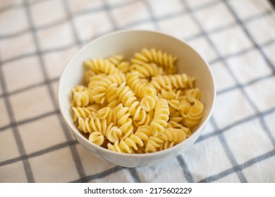 Bowl Of Cooked Pasta Rotini On The Kitchen Table 