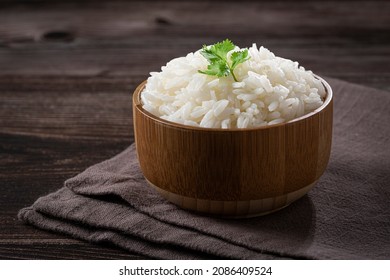 Bowl with cooked rice on the table.