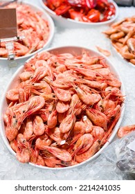 Bowl Of Cooked Shrimp On Display On Ice In Supermarket. Räkfrossa.