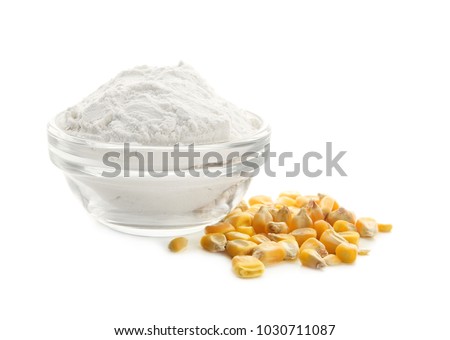 Bowl with corn starch and kernels on white background