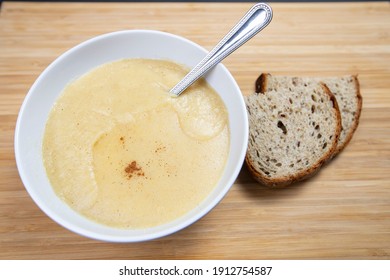 Bowl Of Cornmeal Porridge With Spoon, Top Down View Selective Focus.