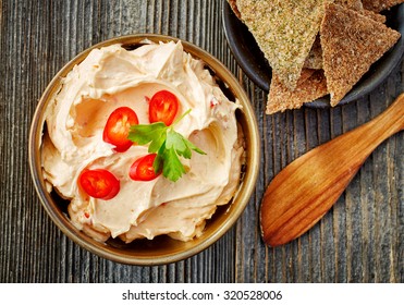 Bowl Of Cream Cheese With Chili And Paprika, Dip Sauce On Wooden Table, Top View