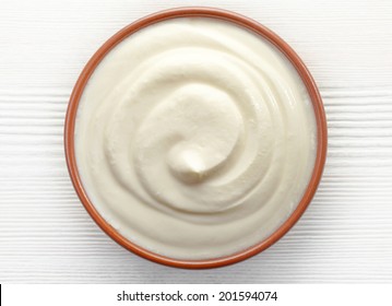 Bowl Of Cream On White Wooden Table, Top View