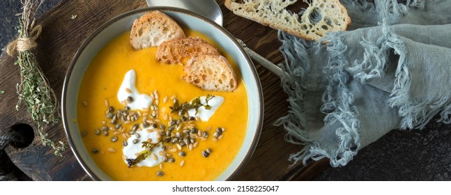 Bowl With Creamy Carrot Soup On The Table