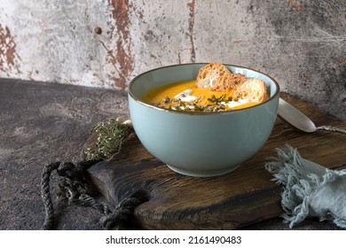 Bowl With Creamy Carrot Soup On The Table