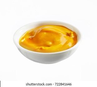Bowl Of Creamy Cheese Dip For Nachos Corn Snacks Or Appetizers Isolated On White