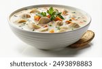 A bowl of creamy clam chowder with mushrooms, carrots, and parsley garnished with fresh parsley.