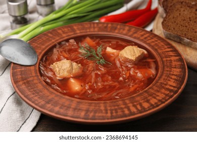 Bowl of delicious borscht on table, closeup. - Shutterstock ID 2368694145