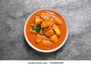 Bowl Of Delicious Chicken Curry On Grey Table, Top View