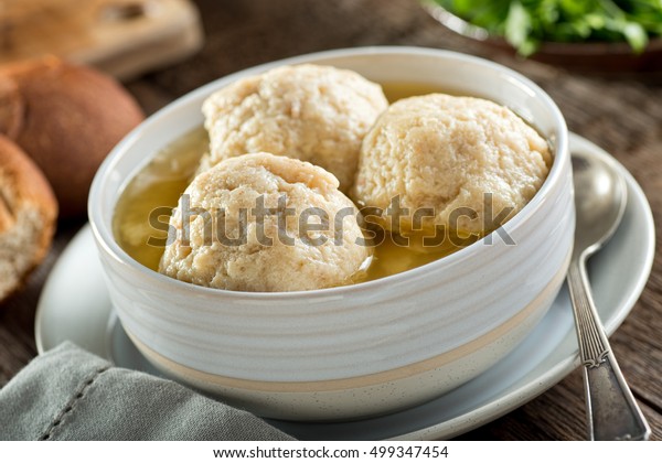 A\
bowl of delicious homemade authentic matzo ball\
soup.