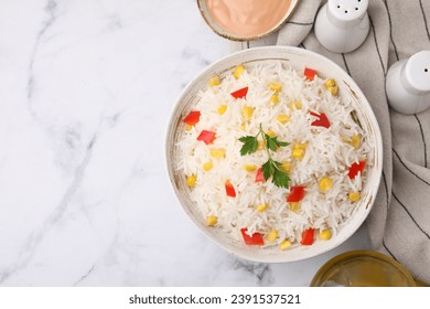 Bowl of delicious rice with vegetables and parsley on white marble table, flat lay. Space for text - Powered by Shutterstock