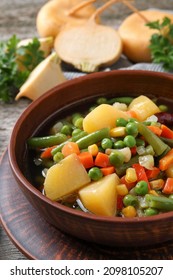 Bowl Of Delicious Turnip Soup On Wooden Table