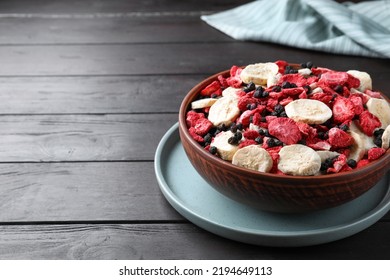 Bowl Of Different Freeze Dried Fruits On Wooden Table. Space For Text