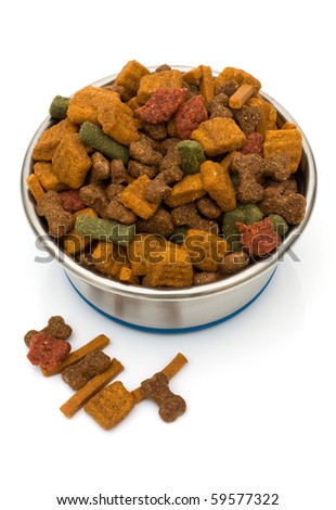 A bowl of dog food isolated on a white background, dog treats