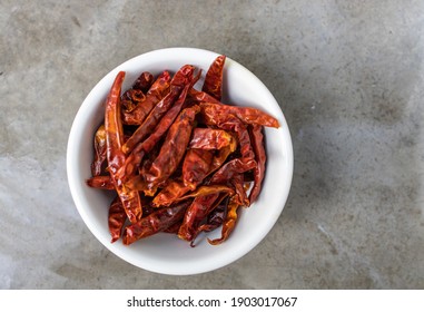 A Bowl Of Dried Chilli Pepper  Used For Thai Cooking With Grey Background And No People