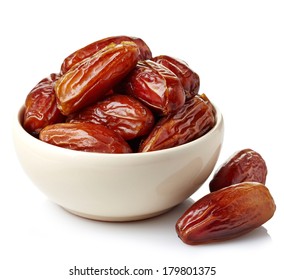 Bowl of dried dates isolated on white background - Shutterstock ID 179801375