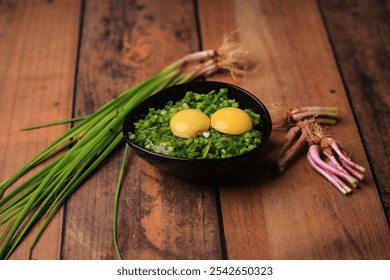 bowl of egg yolks isolated on white background, top view with green vegetables.close up image of two eggs yolk in a bowl are one of the food ingredients on the restaurant table in the kitchen . - Powered by Shutterstock