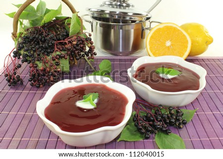 a bowl with Elderberry soup of fresh elderberries Stock photo © 