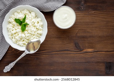 Bowl of farm cottage cheese, top view. Protein food.