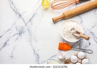Bowl with flour, eggs and kitchen utensils on light background - Shutterstock ID 2212114781