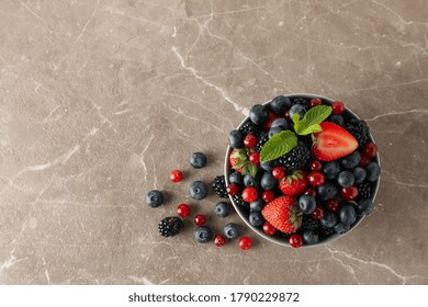 Bowl With Fresh Berries On Gray Table, Top View