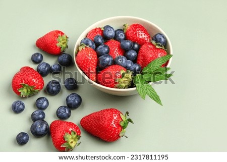 Similar – Bowl with red berries and mint leaves