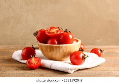 Bowl with fresh cherry tomatoes on wooden table - Powered by Shutterstock