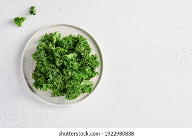 Bowl Of Fresh Green Chopped Kale On Light Gray Stone Background, Top View. Ingredient For Making Healthy Salad. Clean Eating, Detox Or Diet Concept. Mock Up.