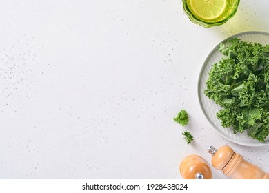 Bowl of fresh green chopped kale on light gray stone background, top view. Ingredient for making healthy salad. Clean eating, detox or diet concept. Mock up. - Powered by Shutterstock