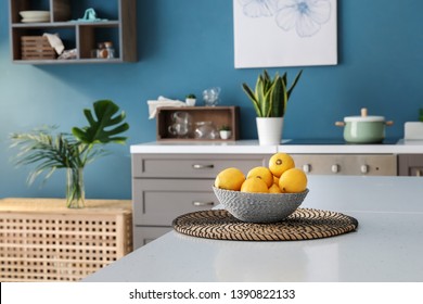 Bowl With Fresh Lemons On Table In Interior Of Modern Kitchen