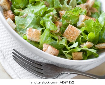 A Bowl Of Fresh Lettuce Salad With Crouton