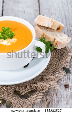 Similar – Foto Bild Kürbissuppe in weißer Schüssel und Zutaten auf Holztisch