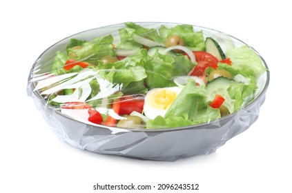 Bowl of fresh salad wrapped with transparent plastic stretch film isolated on white