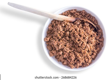 Bowl Of Freshly Prepared Savory Ground Or Minced Beef Mixture For Filling Tortillas Or Tacos With A Wooden Spoon On A White Background With Copy Space, Overhead View