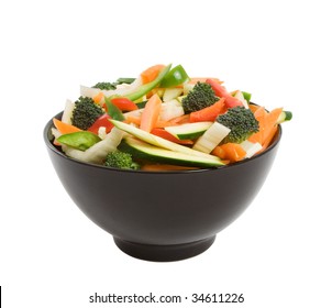 Bowl Of Freshly Sliced Vegetables For Stir Fry Isolated Over White Background