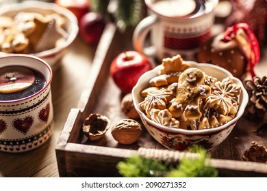 A Bowl Full Of Christmas Gingerbread Along With Hot Punch.