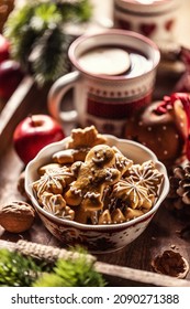 A Bowl Full Of Christmas Gingerbread Along With Hot Punch.