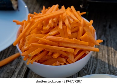 Bowl Full Of Orange Carrot Sticks. Close Up. Selective Focus.