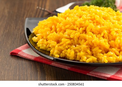 bowl full of rice on wooden background