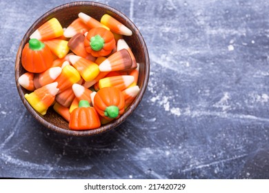 A Bowl Full Of Seasonal Halloween Candy Corn, A Traditional Fall Treat.