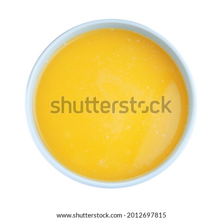 Bowl of Ghee butter isolated on white, top view