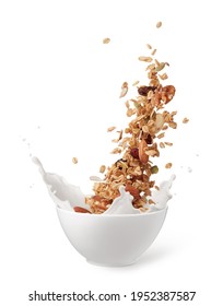 Bowl Of Granola With Milk Splashing Isolated On White