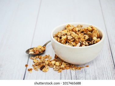 Bowl with granola  on a old wooden table