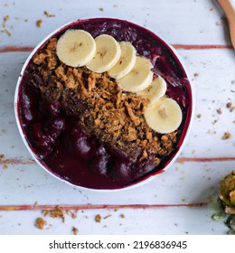  Açaí Bowl With Granola, Tropical Fruits, Banana, Raspberry, Condensed Milk And Cereal. Selective Focus. Close Up.
