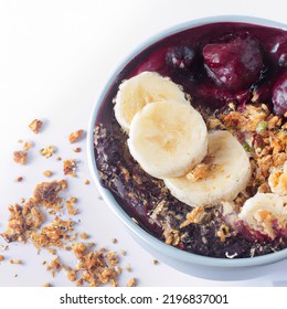  Açaí Bowl With Granola, Tropical Fruits, Banana, Raspberry, Condensed Milk And Cereal. Selective Focus. Close Up.
