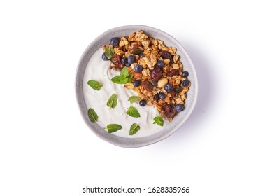 Bowl Of Granola With Yoghurt On White Background