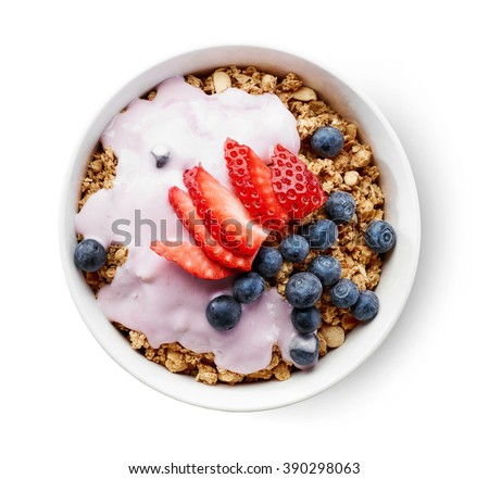 bowl of granola with yogurt and berries isolated on white background, top view