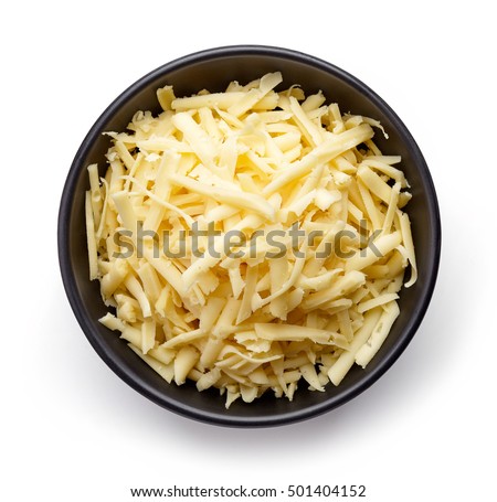 Bowl of grated cheese isolated on white background. top view