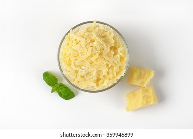 Bowl Of Grated Parmesan Cheese On White Background