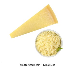 Bowl Of Grated Parmesan And Whole Cheese Wedge